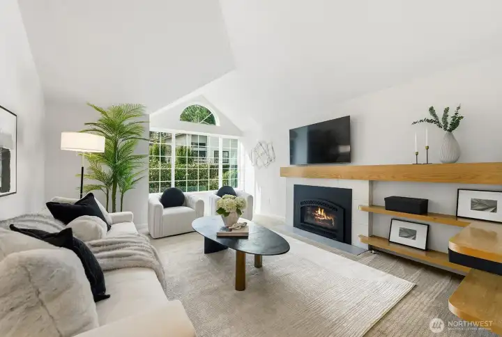 Cozy living room with gas fireplace and high ceilings