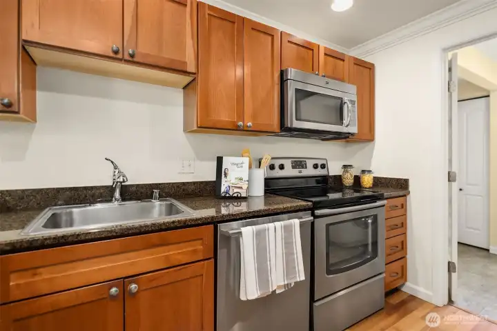 Another view of the kitchen with a close-up of the stainless steel appliances — all replaced within the last three years