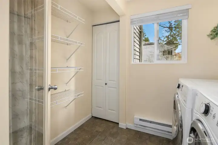 Utility room storage with a functioning window that brings in natural light and fresh air