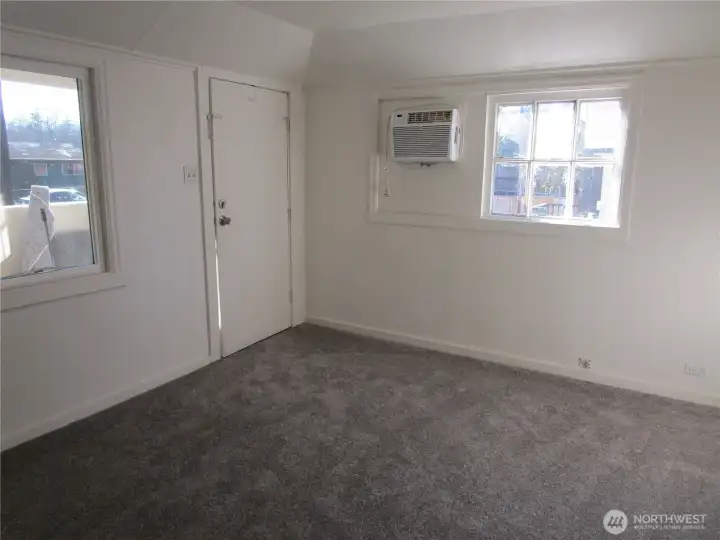 Living room with new carpet.