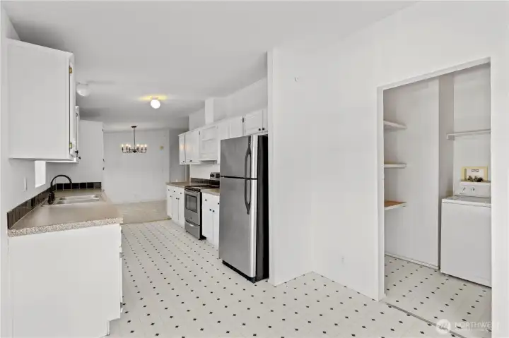 Laundry and more pantry storage just off the kitchen.