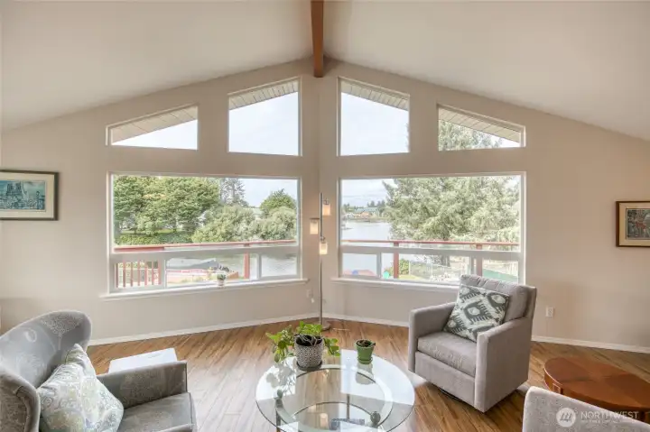 Inside the home, the upper level windows in the living area is the focal point.