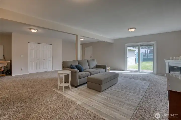 Downstairs features another large family room.  Laundry closet is on the back wall.