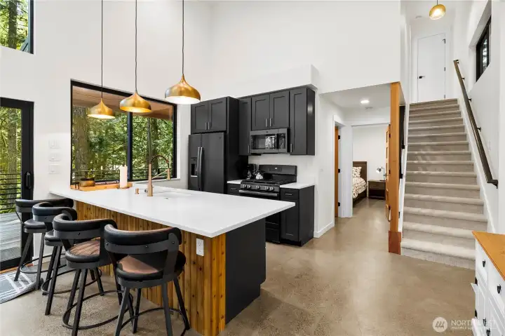 Quartz slab counters in open kitchen