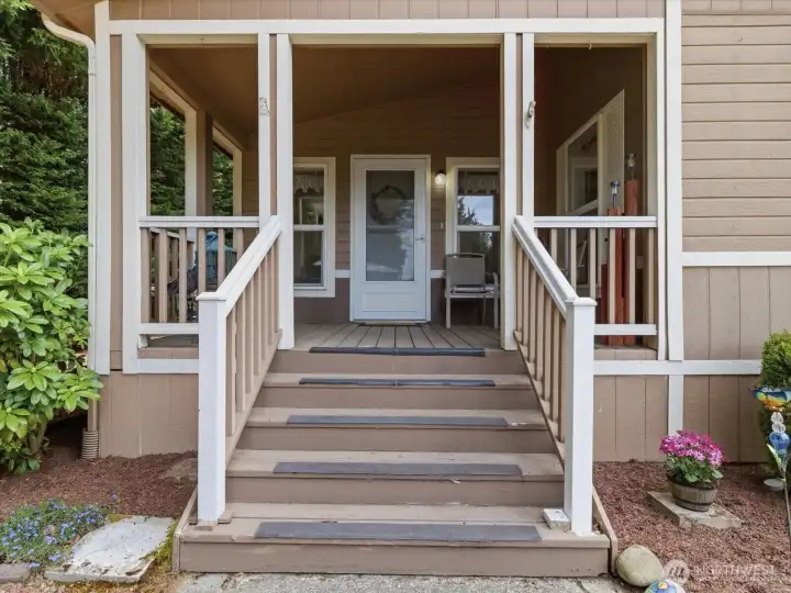 Covered front porch welcomes you home.
