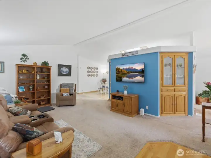 Looking into the living room from the front door.   Built in shelving in the living room.