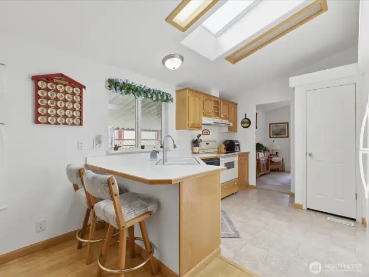 Vaulted ceilings with skylights in the kitchen.
