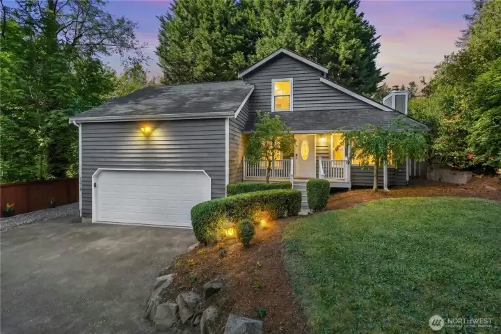 Landscape lighting throughout the front and rear yards for evening ambiance.