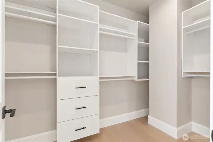 Primary bedroom walk in closet.
