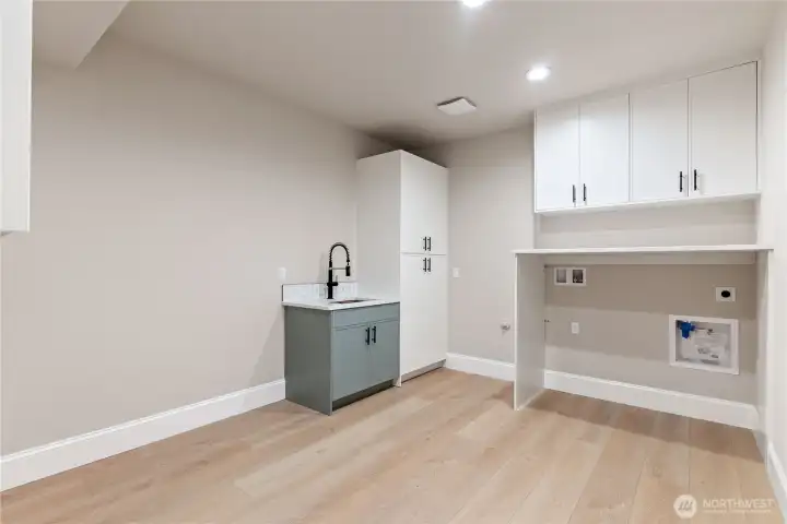 Large utility room with the sink on lower level.