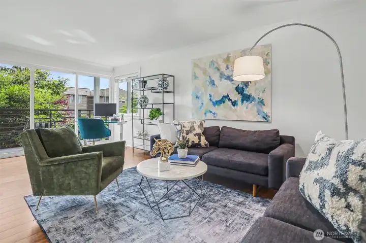 Expansive living room with versatile flex space flows seamlessly to your private deck. Expansive living room with versatile flex space flows seamlessly to your private deck.