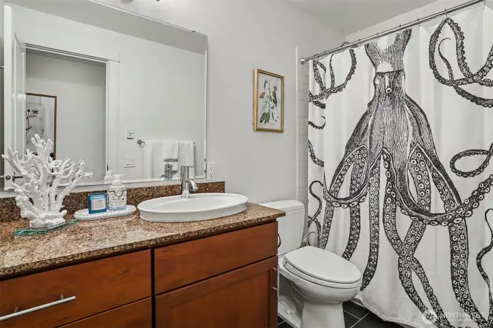 Well-appointed full bath ideal for guests or roommates. Well-appointed full bath ideal for guests or roommates.