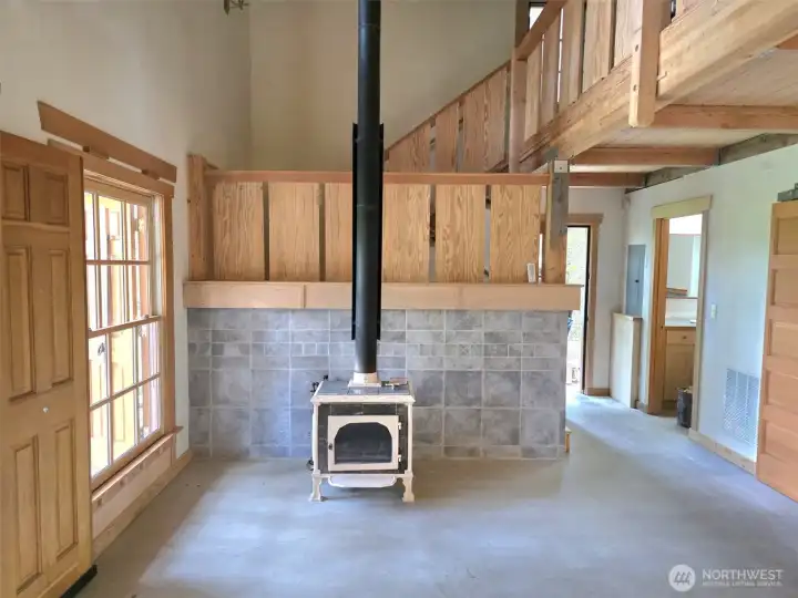 Concrete floors, lots of wood trim and stone accents. Concrete floors, lots of wood trim and stone accents.