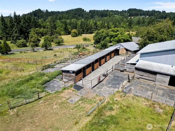 Aerial view of the shed-row stalls and the backside of the barn. Aerial view of the shed-row stalls and the backside of the barn.