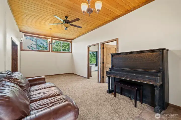Upon entry, your new living room with high ceilings and mini-split heat pump. Upon entry, your new living room with high ceilings and mini-split heat pump.