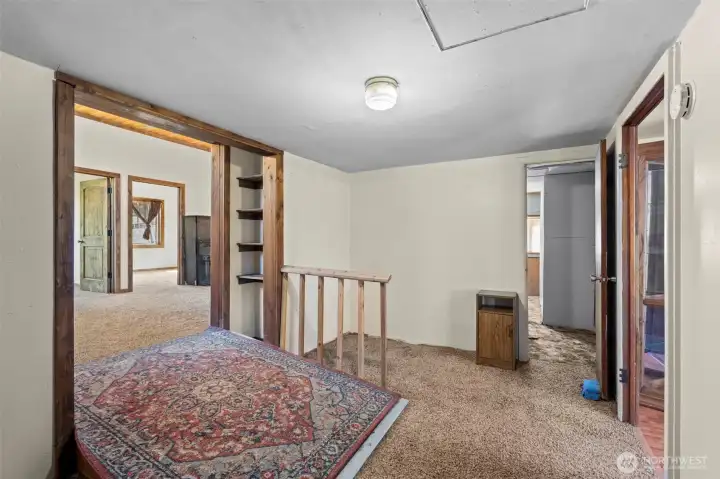 Hallway area with cute built-in shelving. Straight ahead is the bonus room. Hallway area with cute built-in shelving. Straight ahead is the bonus room.