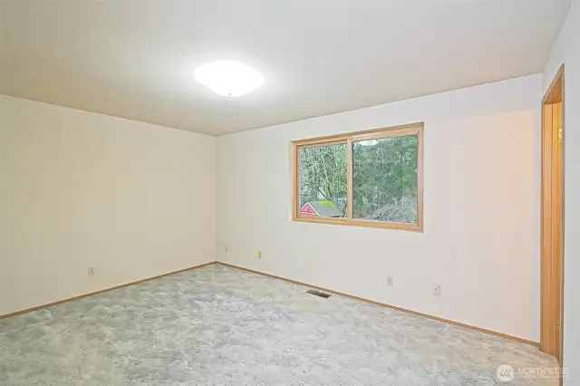 Primary bedroom on the upper level with an ensuite bath.