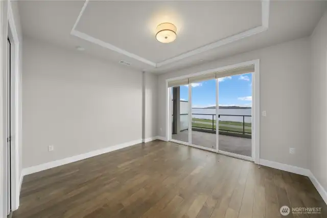 Primary bedroom with a slider that opens up to your patio