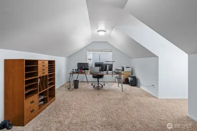Very large office/rec room/art room with a lot of natural lighting