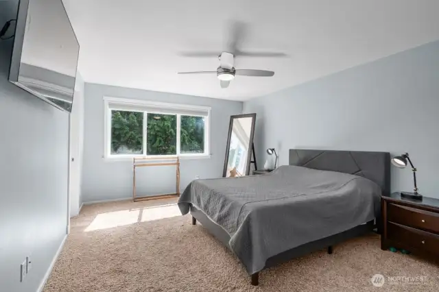 Primary bedroom with bathroom and walk in closet