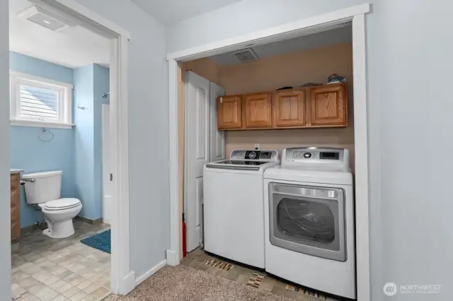 Washer/dryer closet upstairs next to primary bedroom and main bathroom