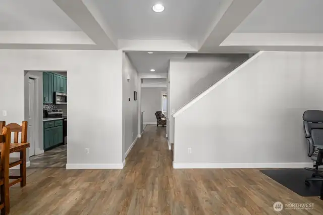Upon entering the front door, newer LVP flooring in living room, family room, dining room and stairway