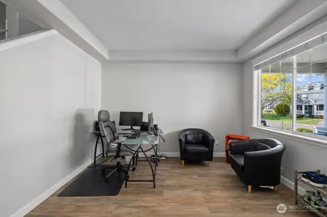 To the right of the front entrance (living room/office space)
