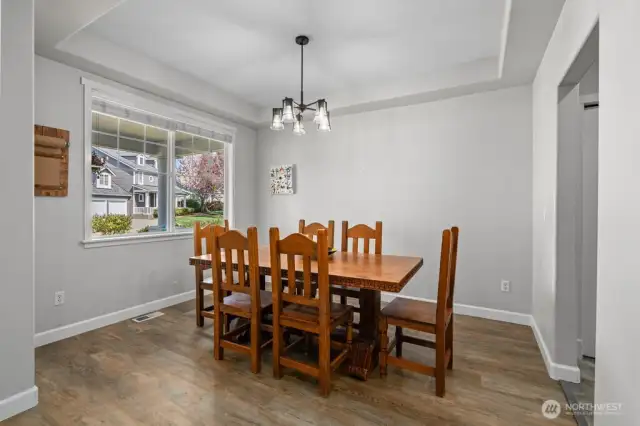 To the left of the front entrance - dining area/living room space/office area