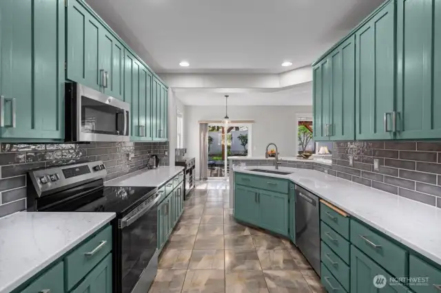 Beautifully remodeled  kitchen in 2025 with new appliances (view upon entering from the dining room area)