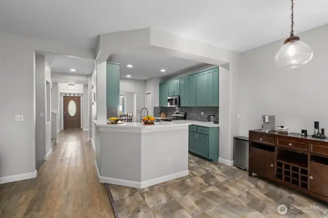 Bar seating at the other end of the kitchen