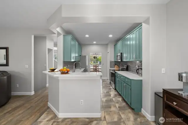 Recessed lights brighten up the beautiful kitchen