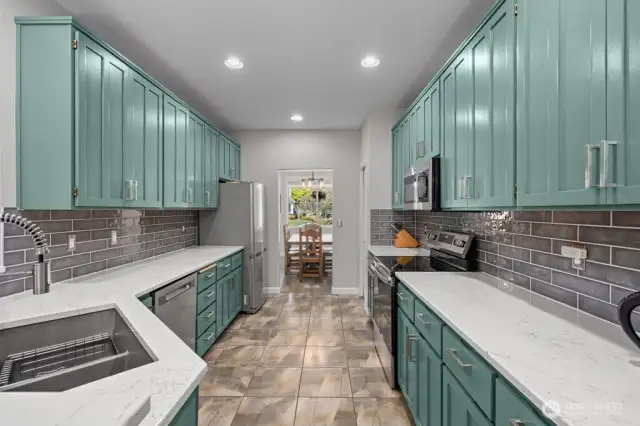 New quartz countertops, granite composite sink, garbage disposal and tile backsplash