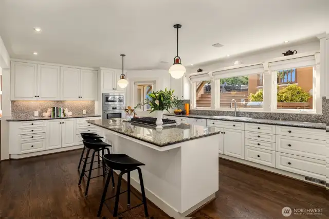 Allied Maker light fixtures and new appliances freshened up the kitchen, which has great bones and a fantastic layout.  Huge windows look out upon the back deck and enclosed yard.