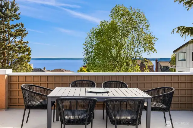 Built atop the 2-car garage addition that was part of the extensive 1992 rebuild (designed by Rex Hohlbein Architecture) the large deck is spacious enough for dining and lounging, with beautiful light and views.  This is just a few steps up from the back door off the kitchen.