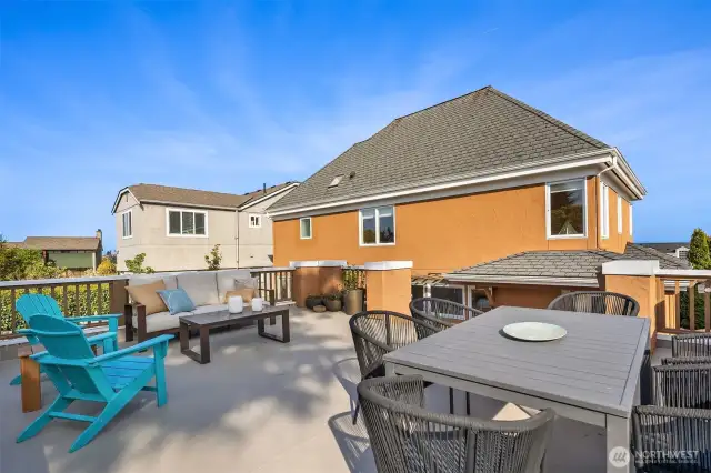 This awesome deck is on top of the 2-car garage with EV Charger, which is accessed by the quiet neighborhood alley in back.