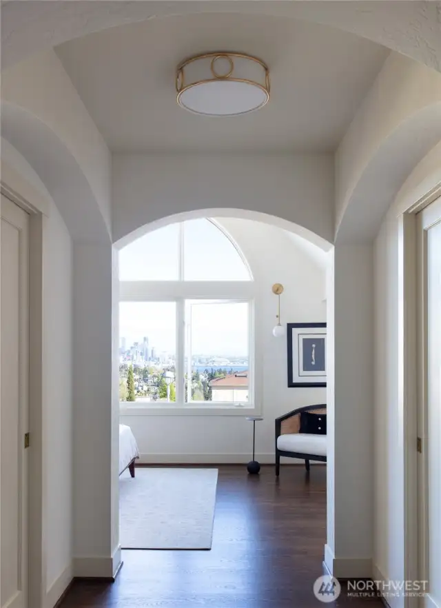Two walk-in closets tuck discreetly behind pocket doors in the lovely Primary Suite entry.