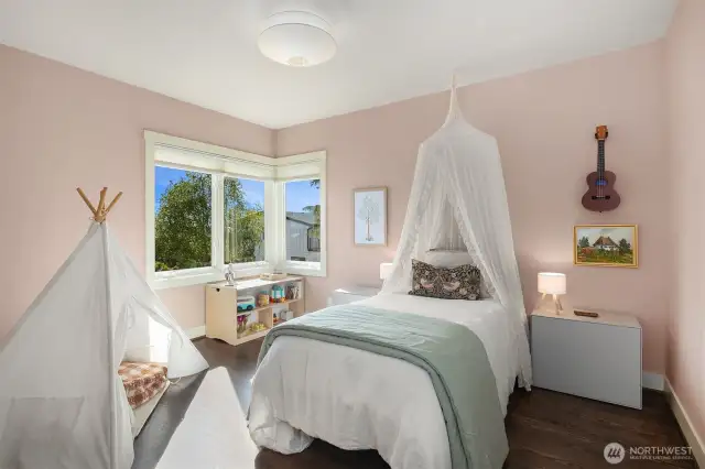 In addition to the primary suite and that fantastic bonus/view room, this is one of two bright and spacious bedrooms on this upper floor.