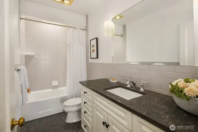 Remodeled in 2017, the upstairs full bath features a skylight.