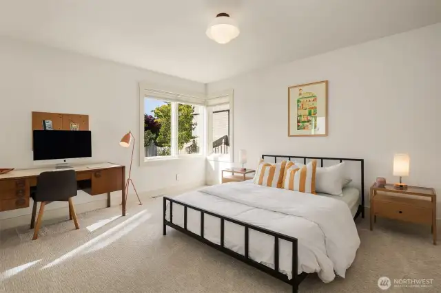 Tucked quietly at the end of the main-floor, this oversized bedroom features a double closet, and windows looking out upon the park-like backyard.