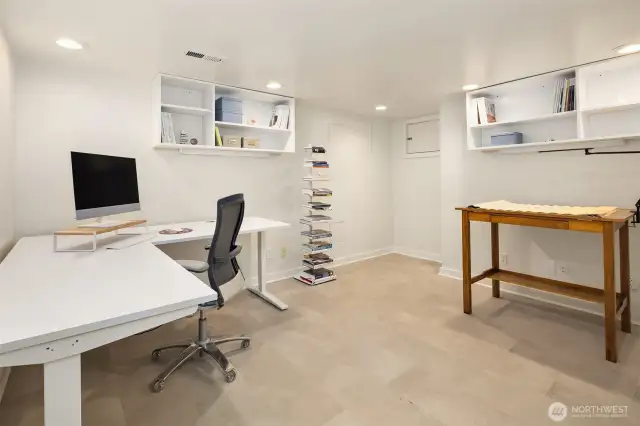 A previously under-utilized room was converted into this designer's-own home office.  Heated floors and great lighting make this a very warm and inviting workspace.