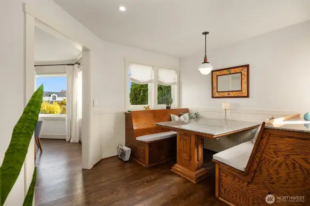 This fun built-in seating offers a casual spot for daily dining, homework, etc., and nicely connects the formal dining room to the kitchen.