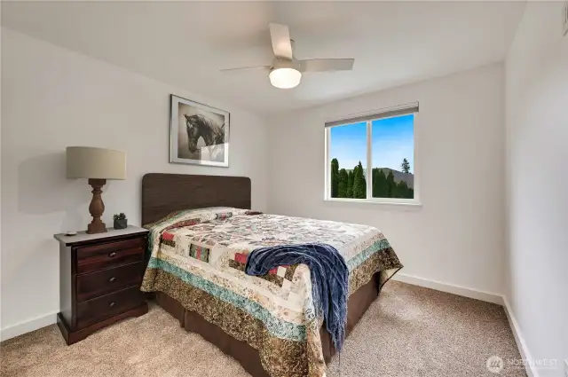 One of 4 bedrooms with a little virtual decor added!