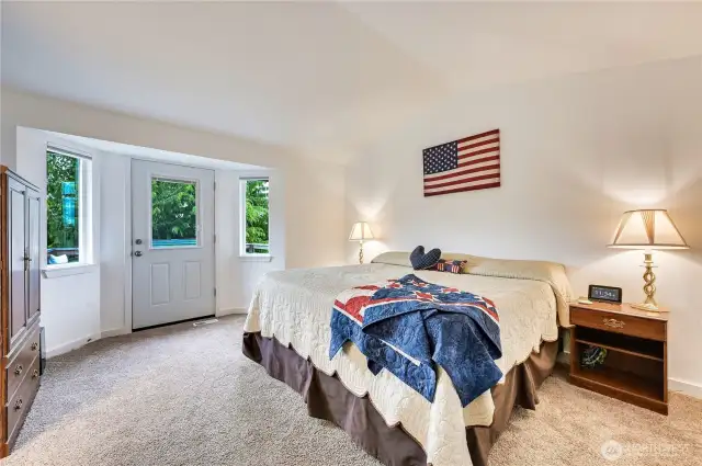 Vaulted Primary Suite is pristine-has its own private deck!