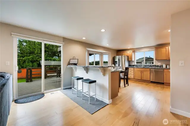 Lovely gleaming hardwood floors, and extra cabinets in this "country kitchen"