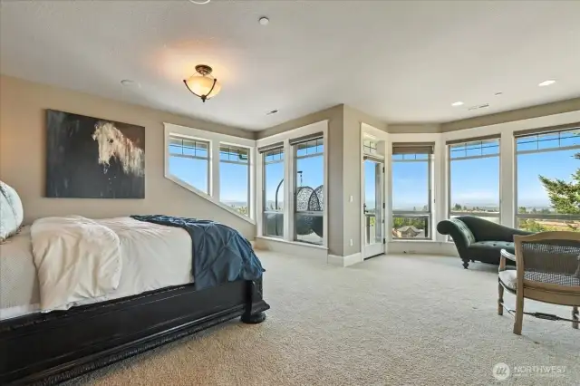 The primary suite boasts breathtaking views from it’s private balcony, a 2-sided fireplace next to a spacious jetted soaking tub, walk-in shower, and large walk-in closet.