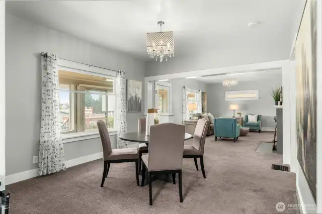 Cross section shot of front entry, dining and living rooms.