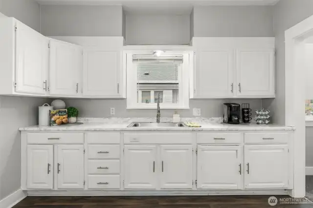 Kitchen with plenty of cabinetry and food preparation space.