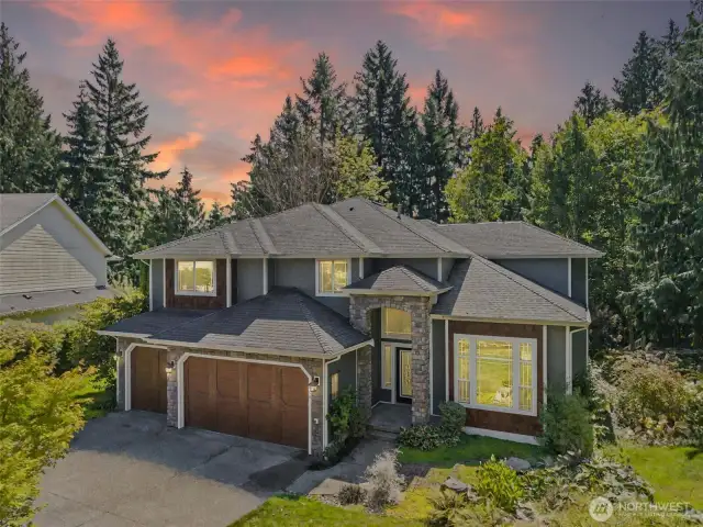 Front of home with 3 car garage