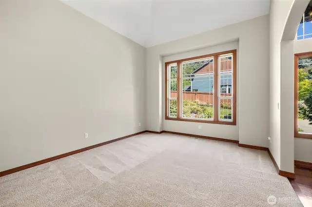 Formal living room with view of front koi pond
