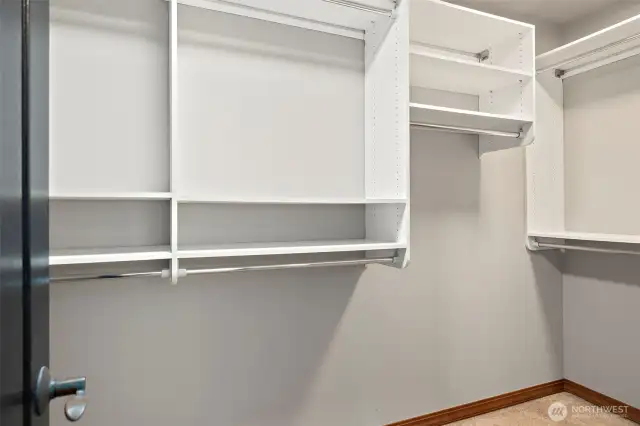 One half of primary walk in closet